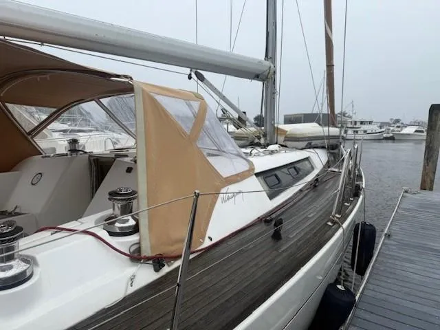 Jet Stream Yacht Photos Pics Sailboat docked, 2003 Wauquiez Centurion 45s, featuring teak deck and beige canopy.