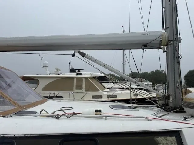 Jet Stream Yacht Photos Pics Sailboat Wauquiez Centurion 45s, 2003 model, docked in a marina with overcast sky.