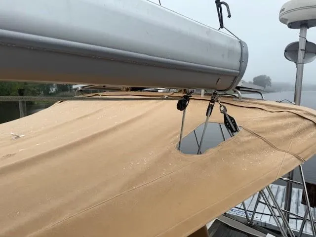 Jet Stream Yacht Photos Pics Sailboat Wauquiez Centurion 45s, 2003 model, with beige canvas cover and visible rigging.