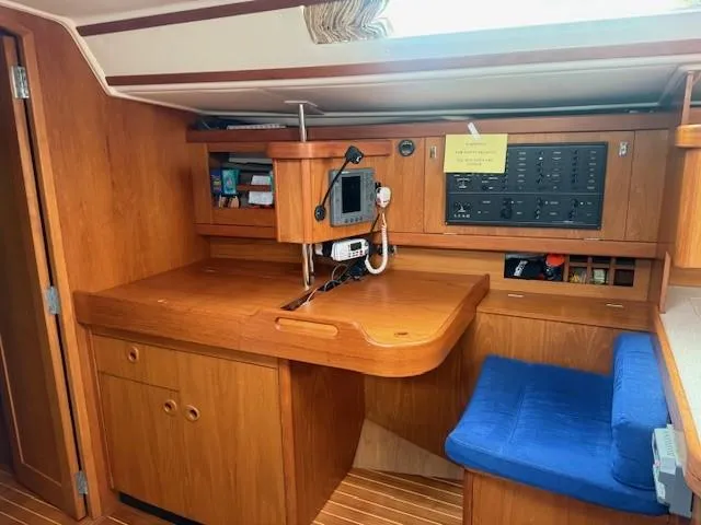 Jet Stream Yacht Photos Pics Interior of 2003 Wauquiez Centurion 45s yacht with navigation station and blue seat.