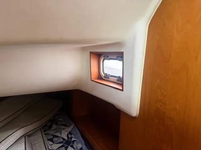 Jet Stream Yacht Photos Pics Interior cabin of 2003 Wauquiez Centurion 45s sailboat with window and bedding.