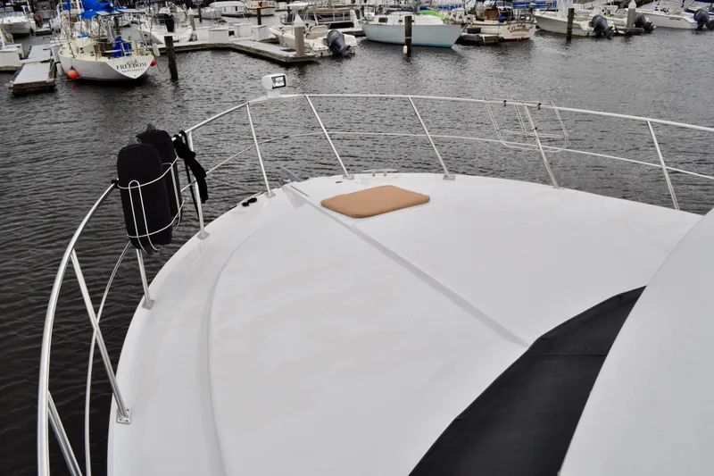 Sweet Freedom Yacht Photos Pics 1999 Carver 406 Aft Cabin Motor Yacht docked at marina, view from bow.