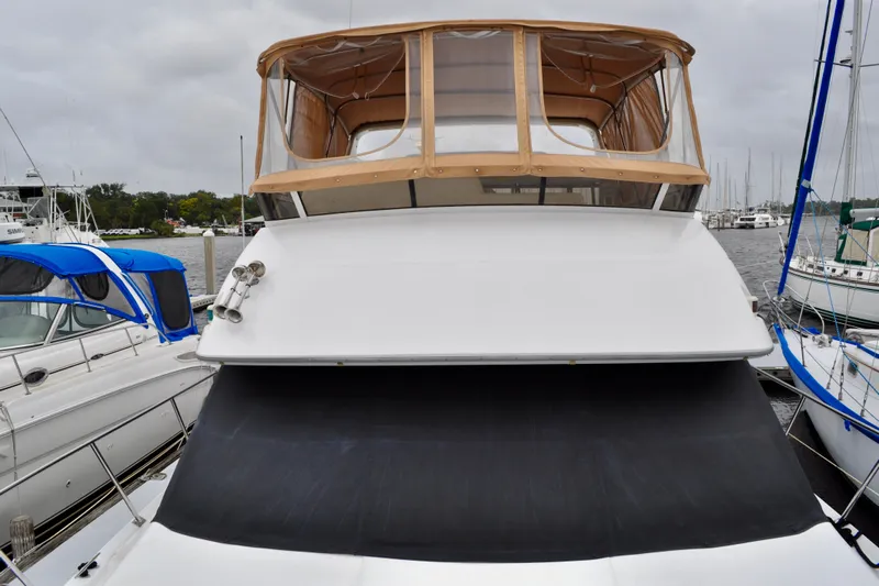 Sweet Freedom Yacht Photos Pics 1999 Carver 406 Aft Cabin Motor Yacht docked at marina, front view.