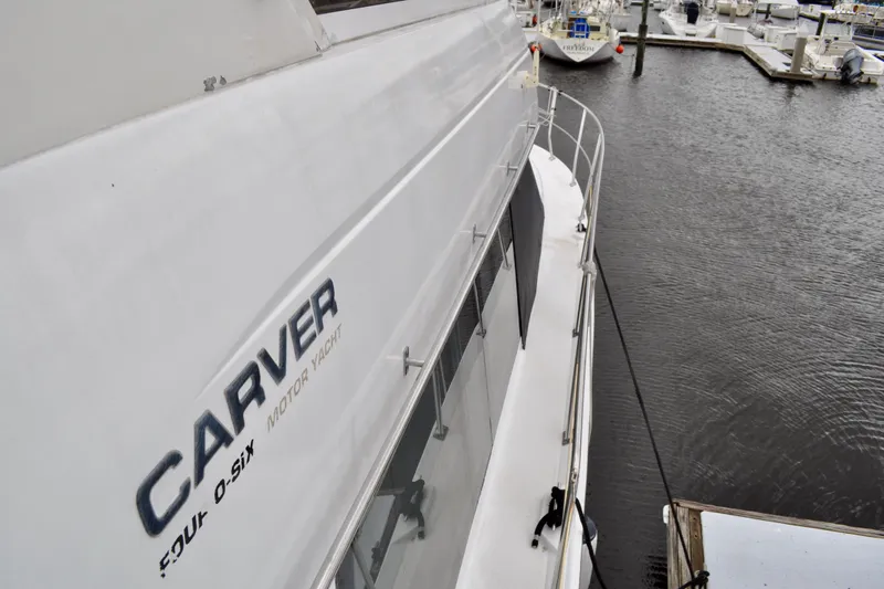 Sweet Freedom Yacht Photos Pics 1999 Carver 406 Aft Cabin Motor Yacht docked at marina, side view.