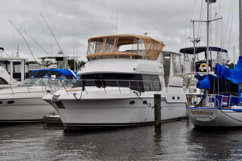 Sweet Freedom Yacht Photos Pics 1999 Carver 406 Aft Cabin Motor Yacht docked at marina.