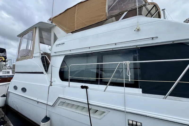 Sweet Freedom Yacht Photos Pics 1999 Carver 406 Aft Cabin Motor Yacht docked, featuring sleek design and spacious cabin.