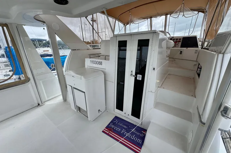 Sweet Freedom Yacht Photos Pics 1999 Carver 406 Aft Cabin Motor Yacht interior with steps and seating area.