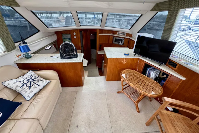 Sweet Freedom Yacht Photos Pics Interior of 1999 Carver 406 Aft Cabin Motor Yacht with cozy seating and modern amenities.
