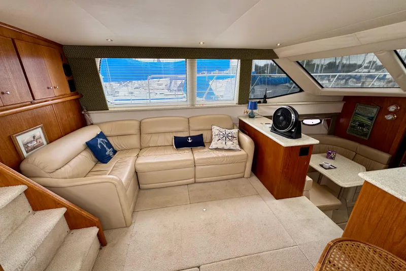 Sweet Freedom Yacht Photos Pics Luxurious interior of 1999 Carver 406 Aft Cabin Motor Yacht with beige leather seating.