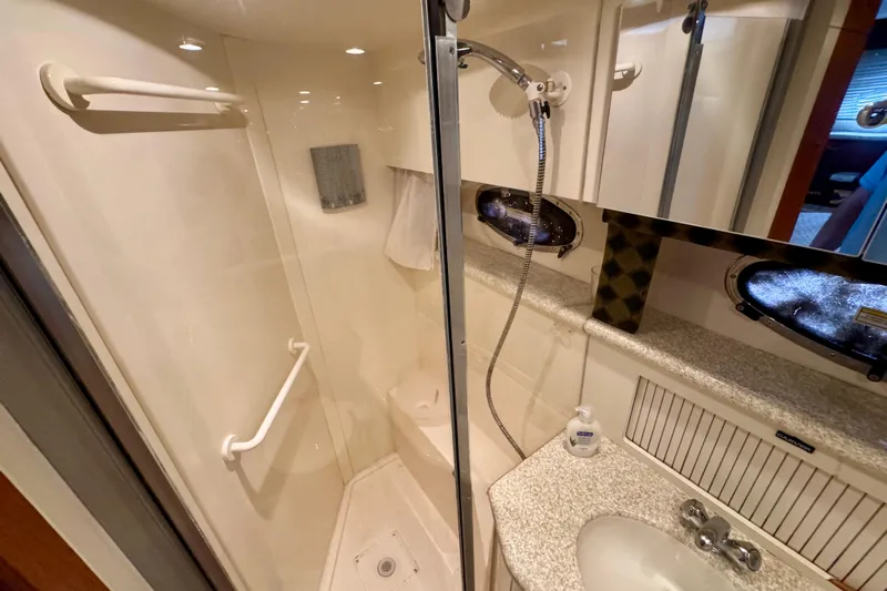 Sweet Freedom Yacht Photos Pics 1999 Carver 406 Aft Cabin Motor Yacht bathroom with shower and sink.