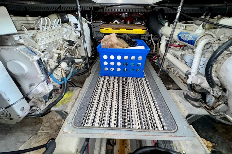 Sweet Freedom Yacht Photos Pics Engine room of 1999 Carver 406 Aft Cabin Motor Yacht with storage basket.