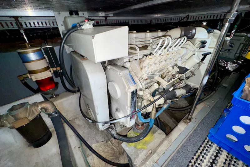 Sweet Freedom Yacht Photos Pics Engine room of 1999 Carver 406 Aft Cabin Motor Yacht, showcasing mechanical components.