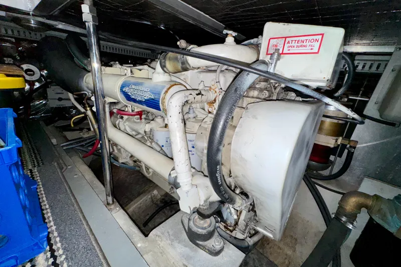 Sweet Freedom Yacht Photos Pics Engine room of 1999 Carver 406 Aft Cabin Motor Yacht, showcasing marine engine components.