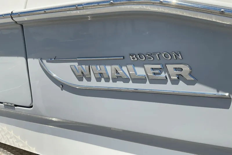  Yacht Photos Pics 2024 Boston Whaler 28 Dauntless logo on boat exterior.