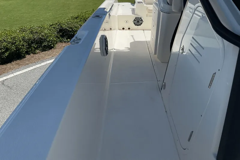  Yacht Photos Pics 2024 Boston Whaler 28 Dauntless boat interior with sleek design and storage compartments.