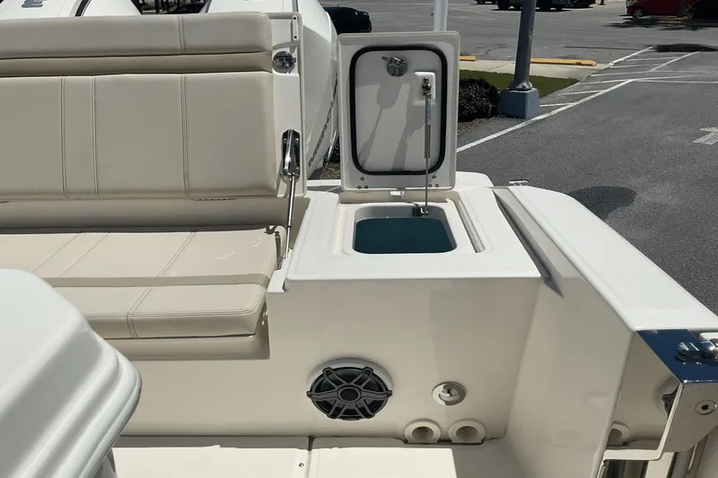  Yacht Photos Pics 2024 Boston Whaler 28 Dauntless boat interior with seating and storage compartment.