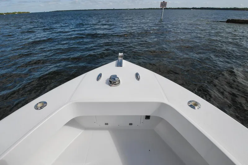  Yacht Photos Pics Bow view of 2019 Ocean Master 336 Center Console on the water.