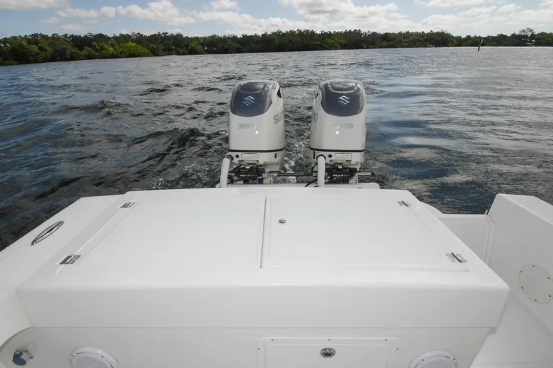  Yacht Photos Pics 2019 Ocean Master 336 Center Console with twin outboard engines on the water.