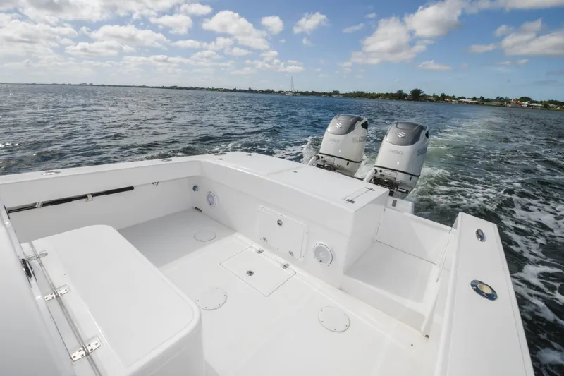  Yacht Photos Pics 2019 Ocean Master 336 Center Console boat with twin outboard engines on open water.