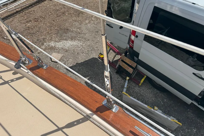 Odyssey Yacht Photos Pics Deck view of 2002 Island Packet 380 sailboat with nearby parked van.