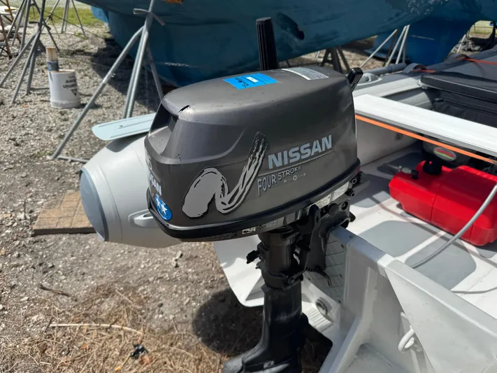 Odyssey Yacht Photos Pics Nissan four-stroke outboard motor on a boat, Island Packet 380, 2002 model.