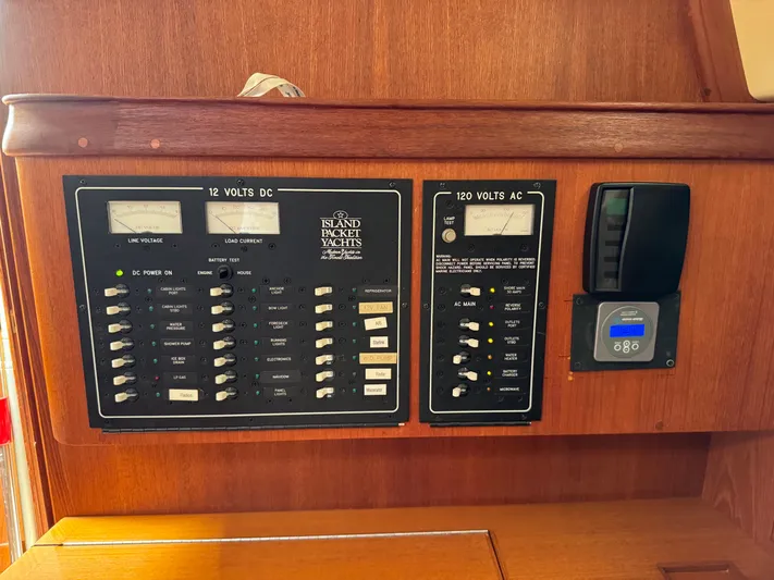 Odyssey Yacht Photos Pics Electrical control panel on a 2002 Island Packet 380 yacht, featuring 12V DC and 120V AC systems.