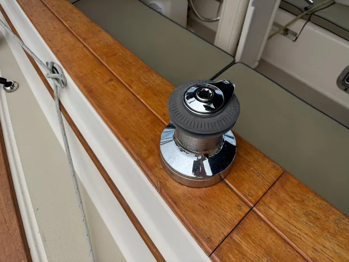 Odyssey Yacht Photos Pics Winch on teak deck of 2002 Island Packet 380 sailboat.