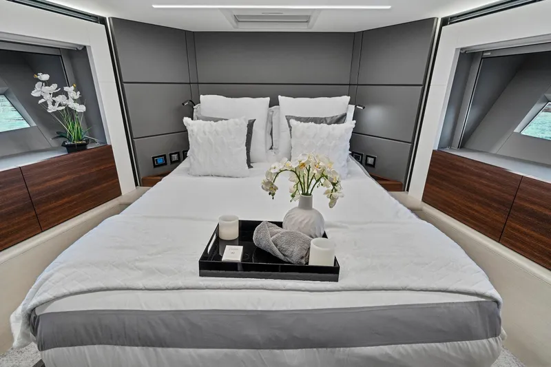 Smile Yacht Photos Pics Luxurious bedroom interior of 2023 Astondoa 66 Flybridge yacht with elegant decor.