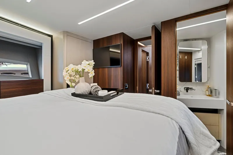Smile Yacht Photos Pics Luxurious bedroom in 2023 Astondoa 66 Flybridge yacht with elegant decor and modern amenities.