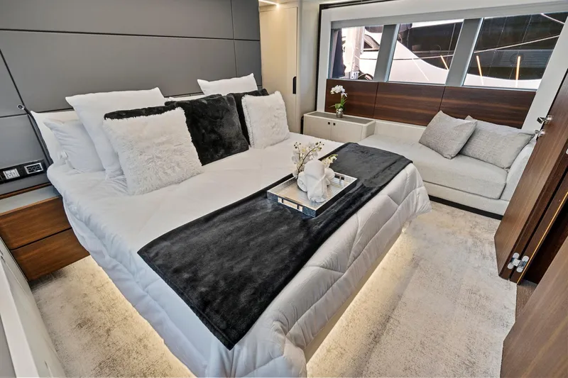 Smile Yacht Photos Pics Luxurious bedroom in 2023 Astondoa 66 Flybridge yacht with elegant decor and modern furnishings.