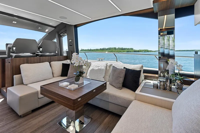 Smile Yacht Photos Pics Luxurious interior of 2023 Astondoa 66 Flybridge yacht with elegant seating and scenic ocean view.