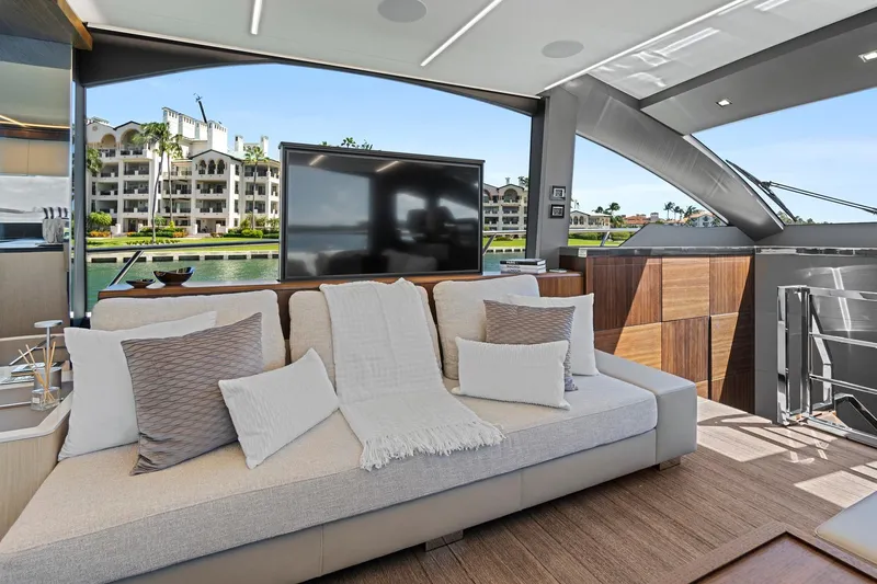 Smile Yacht Photos Pics Luxurious interior of 2023 Astondoa 66 Flybridge yacht with elegant seating and waterfront view.