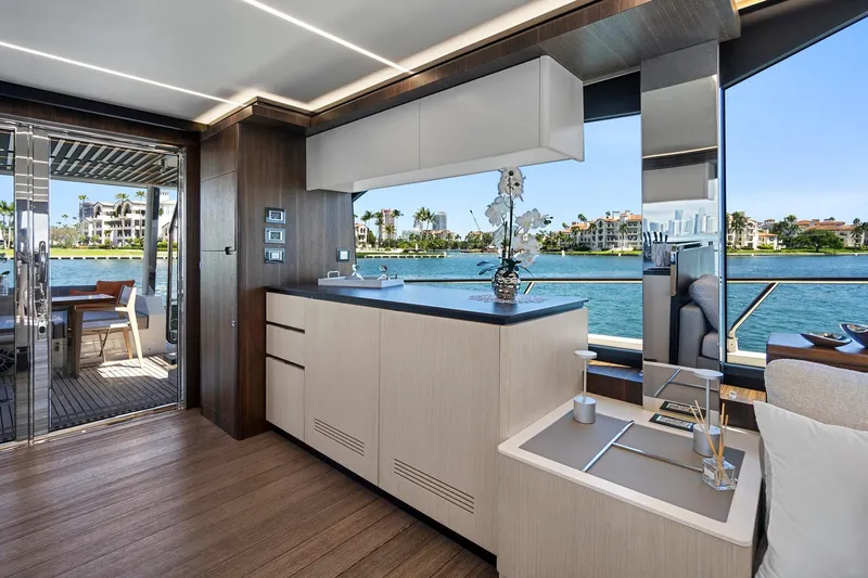 Smile Yacht Photos Pics Luxurious interior of 2023 Astondoa 66 Flybridge yacht with modern kitchen and scenic water view.