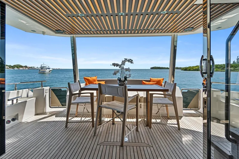 Smile Yacht Photos Pics Luxurious 2023 Astondoa 66 Flybridge yacht deck with elegant seating and ocean view.