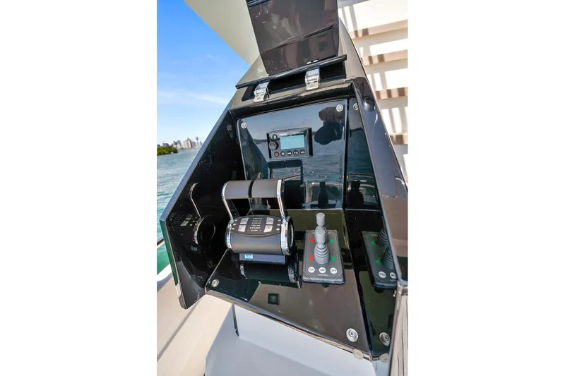 Smile Yacht Photos Pics Control panel of 2023 Astondoa 66 Flybridge yacht with throttle and joystick controls.