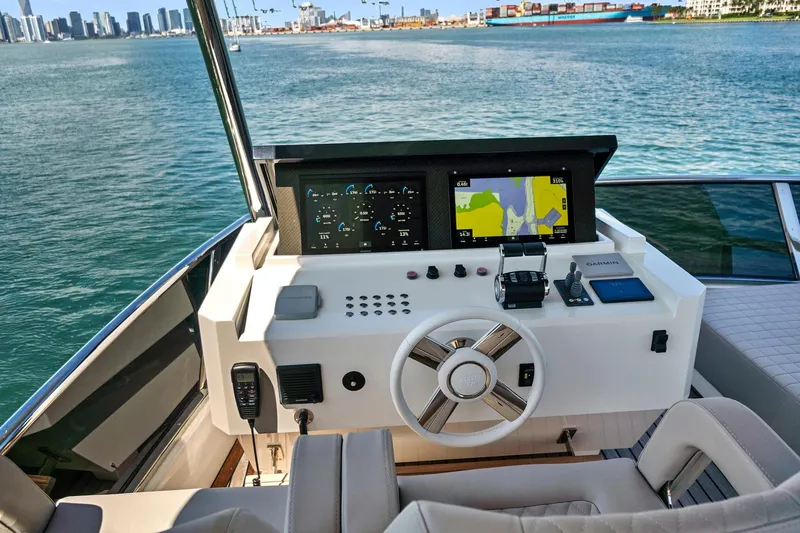 Smile Yacht Photos Pics Flybridge helm of 2023 Astondoa 66, featuring modern navigation and control systems.