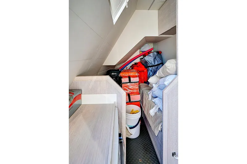 Smile Yacht Photos Pics Storage area in 2023 Astondoa 66 Flybridge yacht, featuring life jackets and equipment.