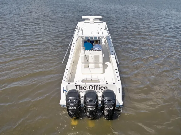  Yacht Photos Pics Invincible 36 Open Fisherman 2023 on water with three outboard engines.