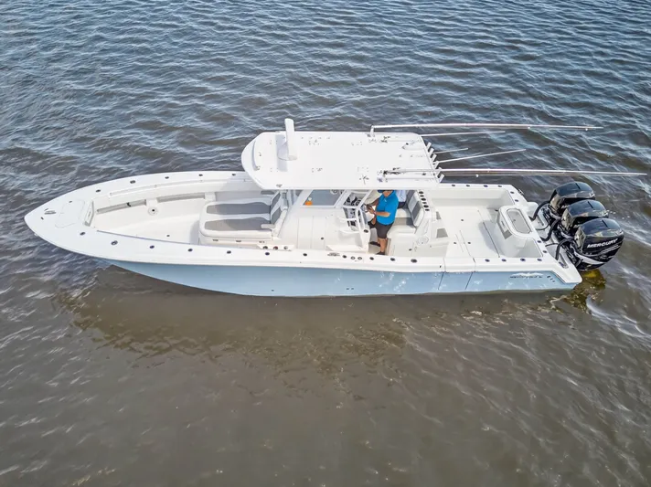  Yacht Photos Pics 2023 Invincible 36 Open Fisherman on calm waters.