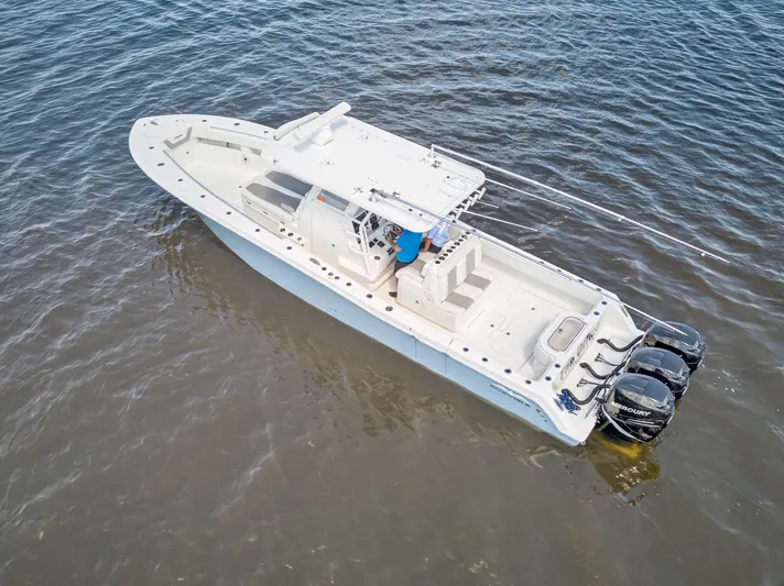  Yacht Photos Pics 2023 Invincible 36 Open Fisherman on calm waters.