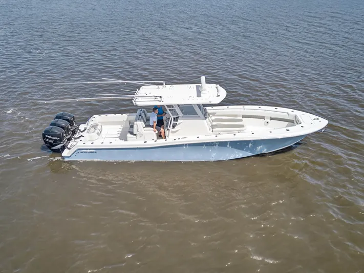  Yacht Photos Pics 2023 Invincible 36 Open Fisherman on calm waters.