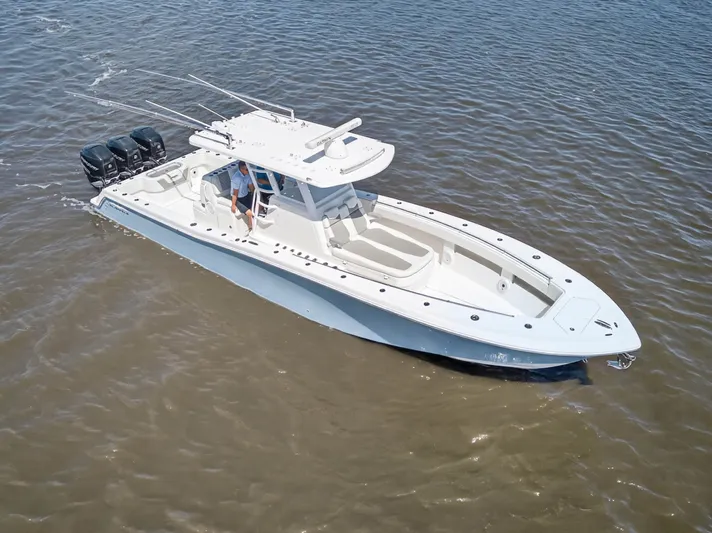  Yacht Photos Pics Invincible 36 Open Fisherman 2023 on calm waters.