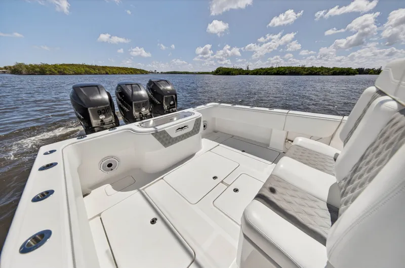  Yacht Photos Pics Invincible 36 Open Fisherman 2023 on calm waters with triple engines.