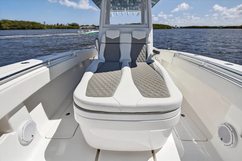  Yacht Photos Pics 2023 Invincible 36 Open Fisherman with luxurious seating area on the water.