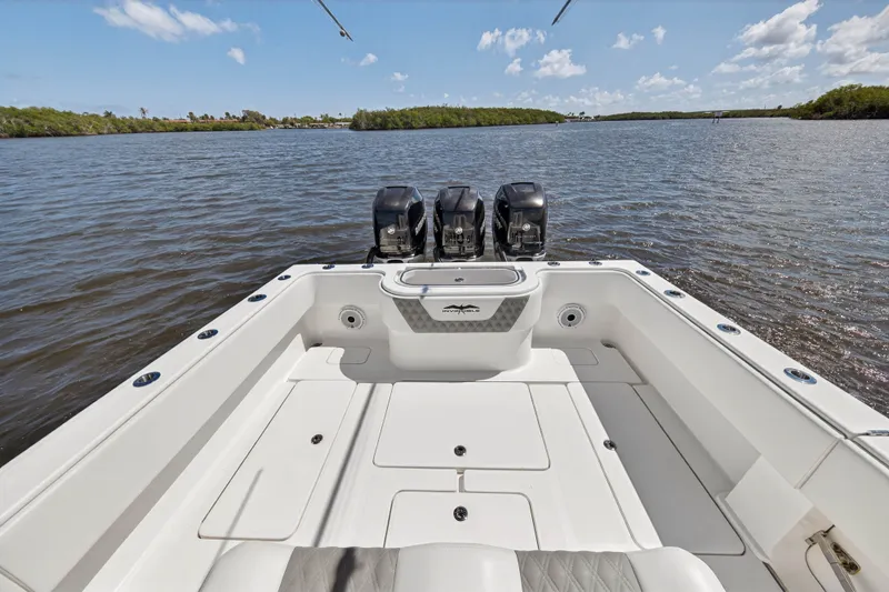  Yacht Photos Pics Invincible 36 Open Fisherman 2023 on calm waters with triple engines.