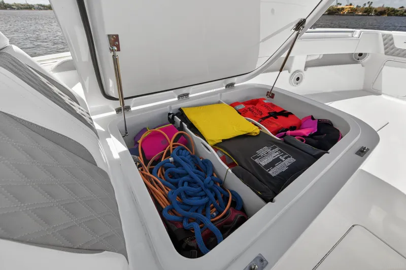  Yacht Photos Pics Storage compartment in Invincible 36 Open Fisherman 2023 with ropes and life jackets.