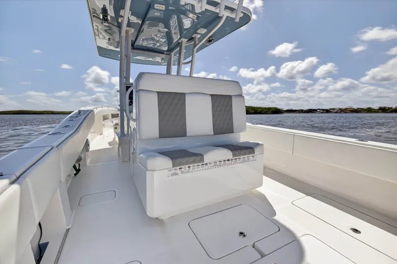  Yacht Photos Pics Invincible 36 Open Fisherman 2023 on calm waters under sunny skies.