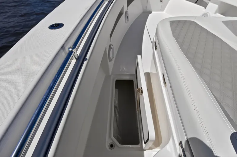  Yacht Photos Pics Invincible 36 Open Fisherman 2023, seating area with storage compartment.