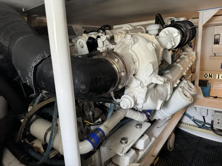  Yacht Photos Pics Engine room of 1996 Viking 50 Convertible yacht, showcasing detailed machinery components.