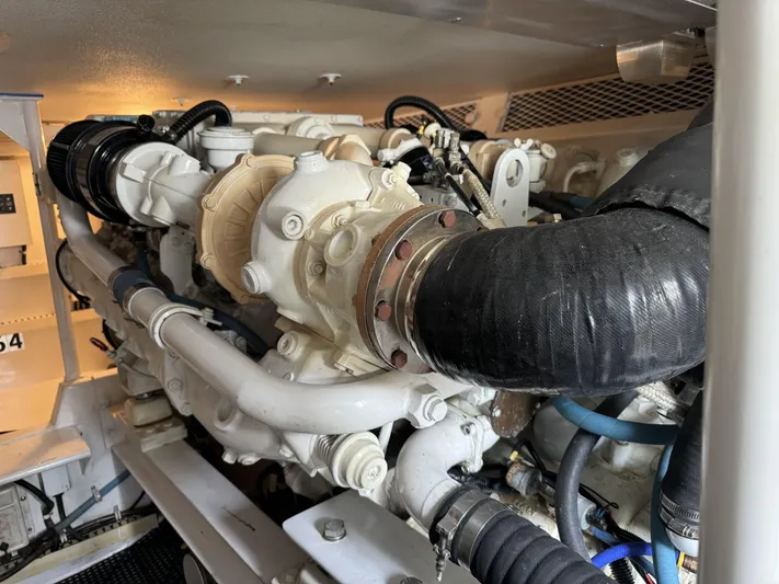  Yacht Photos Pics Engine room of 1996 Viking 50 Convertible yacht, showcasing detailed machinery and components.